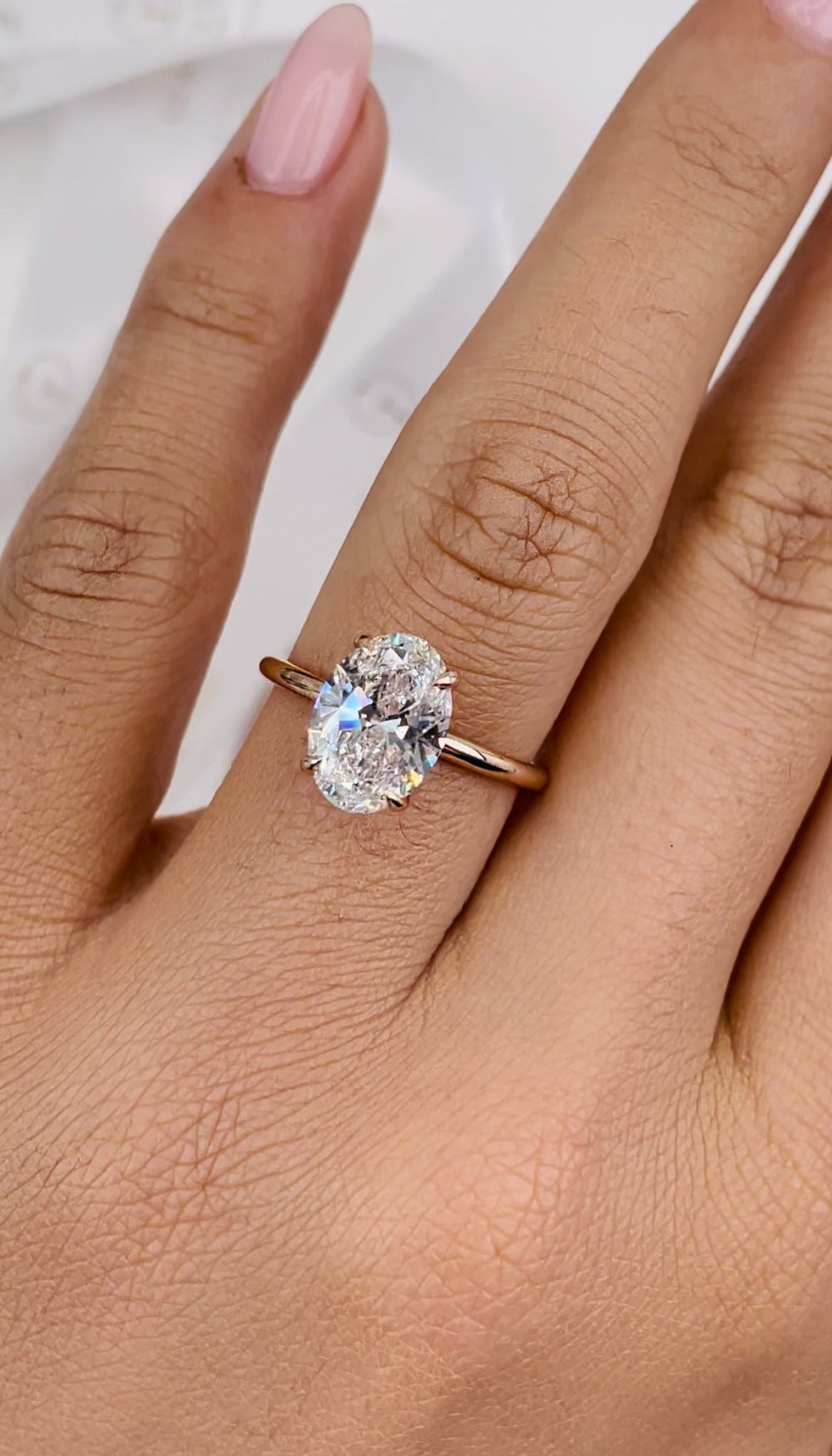 hidden halo oval engagement ring,