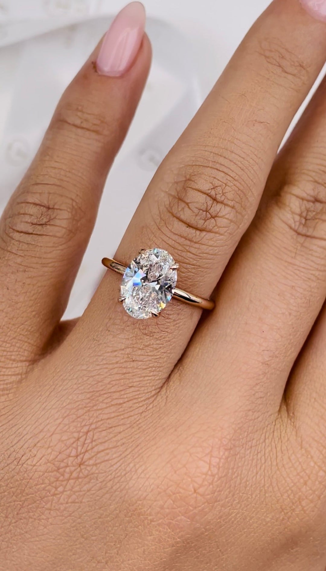 hidden halo oval engagement ring,