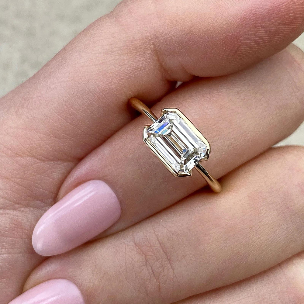 Profile view of emerald cut solitaire engagement ring band